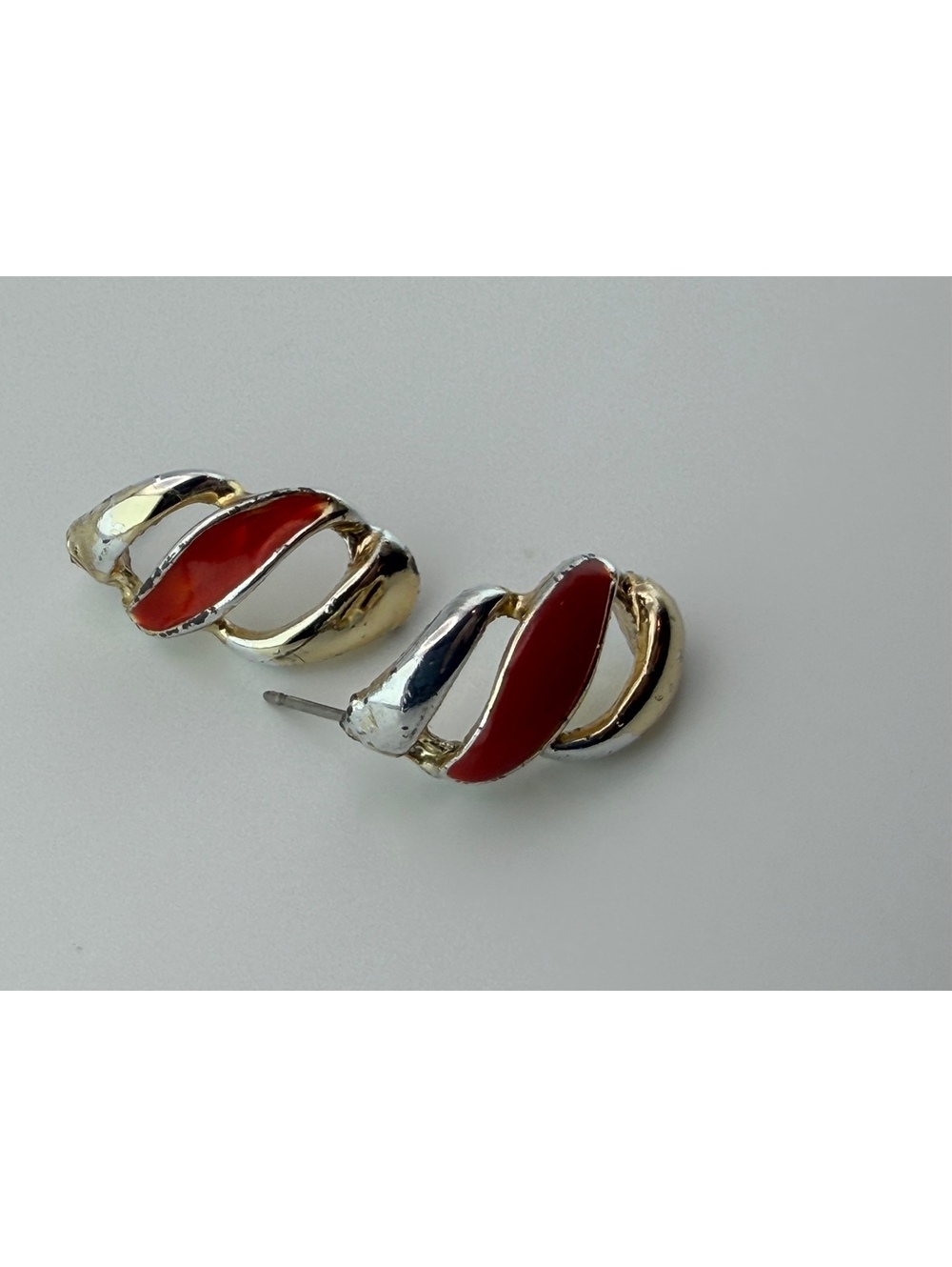 Red and silver tone stud earrings